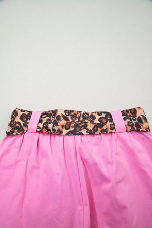 Pink chino shorts with high waist and leopard print belted detail.
