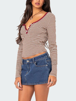 Striped Henley shirt with contrast collar and button detail.