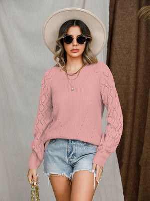 Dusty pink diamond-cut raglan knit sweater with a V-neck and long sleeves.