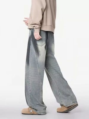 Distressed wide-leg jeans with a belted detail and gradient wash.