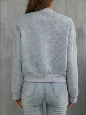 Gray diamond quilted bomber jacket with ribbed cuffs and hem