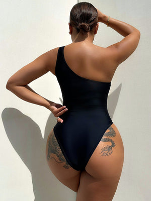 Black asymmetrical one-shoulder swimsuit with mesh panel detail.