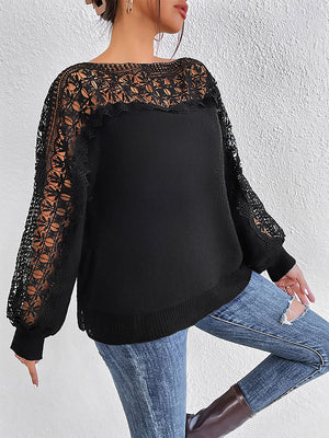 Black acrylic sweater with lace inset balloon sleeves and boatneck.