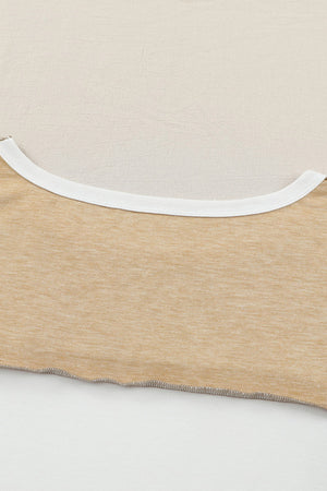 Colorblock knit top in tan with white neckline trim and raw hem detail.