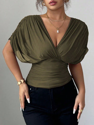 Army green ruched surplice dolman sleeve top with a deep V-neckline.