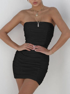 Black ruched strapless bodycon mini dress with a sweetheart neckline.