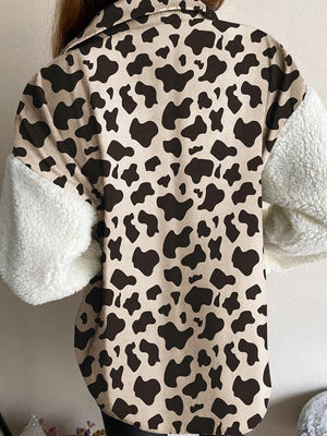 Plaid & Sherpa Hybrid Shacket with cow print body and sherpa sleeves.