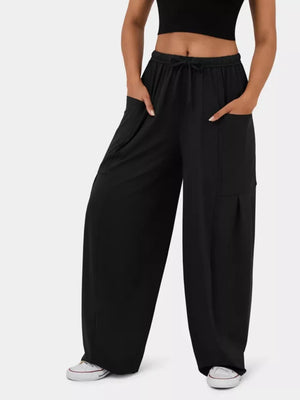 Black wide-leg jeggings with drawstring waist and cargo pockets