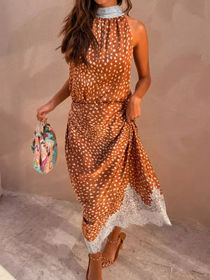Brown polka dot midi skirt with white lace trim and high neck top.