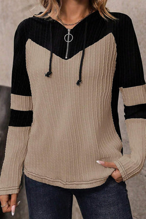 Colorblock ribbed zip-neck hoodie in mocha and black with a chevron pattern and contrast sleeve stripes.