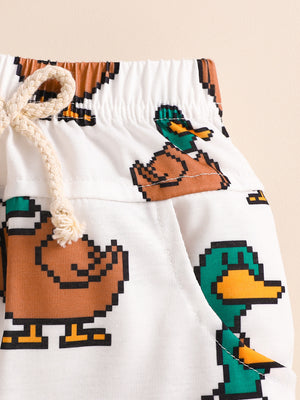 Baby shorts with pixelated duck print and drawstring waist.