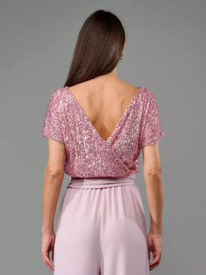 Pink sequin wrap top with wide-leg pants