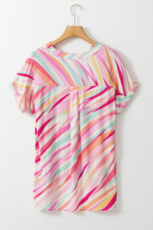 Blush pink blouse with a colorful prismatic stripe pattern and cuffed short sleeves.