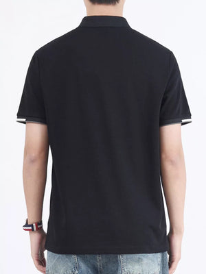 Black cotton polo shirt with contrasting sleeve cuffs and collar detail.