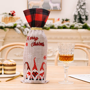 Gnome wine bottle gift bag with red/black buffalo plaid top and Merry Christmas text.