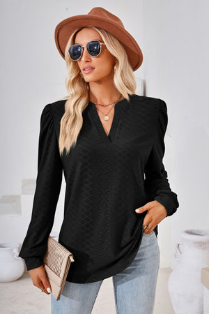 Black textured bishop sleeve blouse with v-neck and subtle diamond pattern.