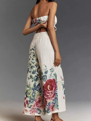 Chic floral print tube top and wide-leg pants set with ruched detail.