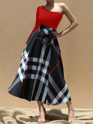 Red one-shoulder midi dress with black plaid skirt and waist tie.