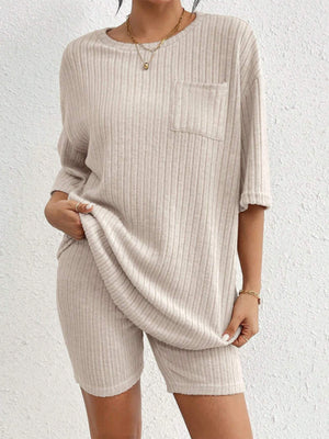 Relaxed ribbed lounge set in Dust Storm, featuring a short-sleeve top with pocket and matching biker shorts.