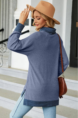 Colorblock raglan turtleneck tunic in Dusty Blue with contrasting cuffs and hem.