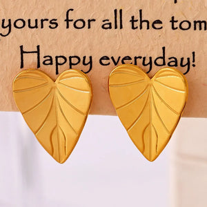 Gold heartleaf stud earrings with vein detail