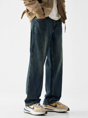 Loose fit blue cotton denim jeans with vintage wash and relaxed leg.