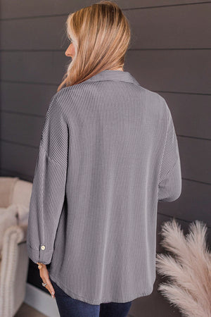 Gray textured stripe overshirt with oversized fit and button cuff detail.