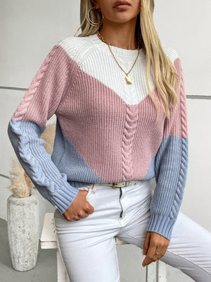 Chevron cable knit sweater in pastel blue, blush pink, and white colorblock with cable knit sleeves.