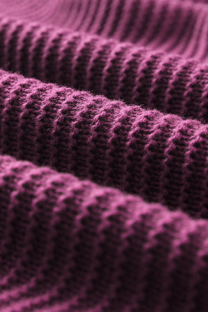 Textured knit hooded pullover in burgundy acrylic with a detailed ribbed pattern.