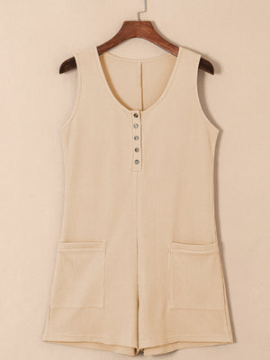 Camel waffle knit button-down romper with pockets and a scoop neck.