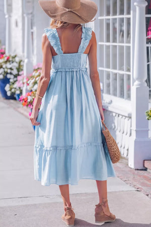 Light blue maternity dress with smocked bodice, ruffle straps, and tiered hem