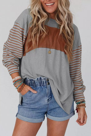 Multi-tonal bishop sleeve shirt in gray with brown colorblock and striped sleeves, crew neck.