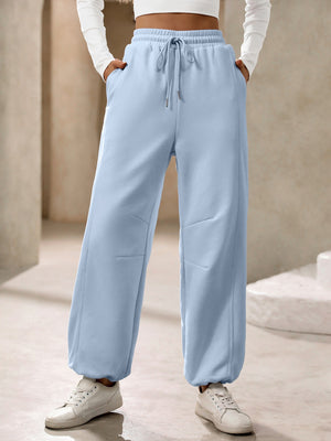 Light blue balloon-leg sweatpants with drawstring waist and pockets