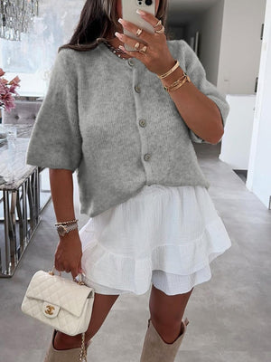 Gray ribbed button-down cardigan with short sleeves and a slightly cropped length.