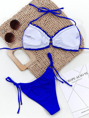 Royal blue bikini set with ruffled trim and tie sides.