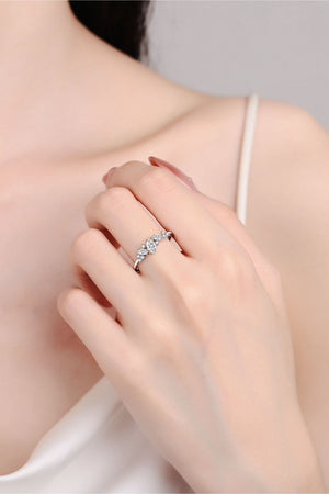 Silver Marquise Cluster Moissanite Ring with sparkling stones on a delicate band.