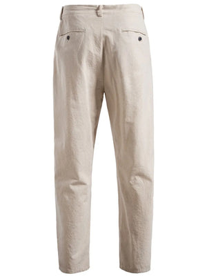 Beige linen drawstring trousers with back pockets and button details.