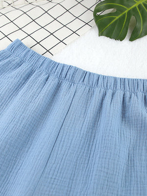 Light blue textured cotton bermuda shorts with elastic waistband