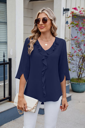 Dark blue V-neck flutter sleeve blouse with ruffled front detail and split sleeves.