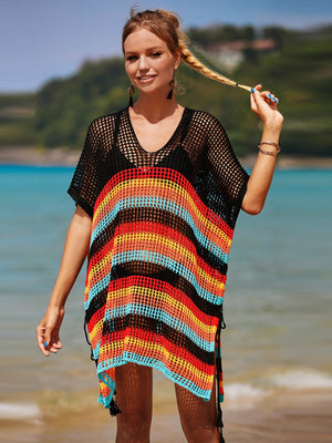 Rainbow stripe crochet beach poncho with black V-neck and short sleeves, featuring tassel ties.