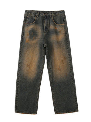 Men's relaxed fit jeans in vintage wash denim with distressed details and a faded effect.