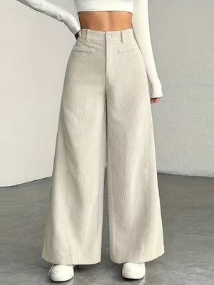Apricot corduroy wide-leg maternity trousers with a high waist and pockets.