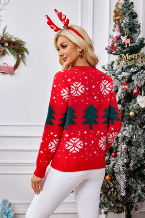 Red acrylic crewneck sweater with white snowflakes and green Christmas trees, long sleeves.
