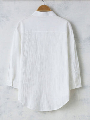 Men's white casual button-up shirt with band collar and textured fabric