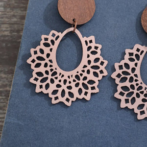 Floral laser-cut wooden drop earrings in Dusty Pink with intricate cutouts and a boho design.