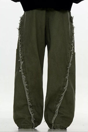 Army green wide-leg sweatpants with distressed fringe detail on side seams.