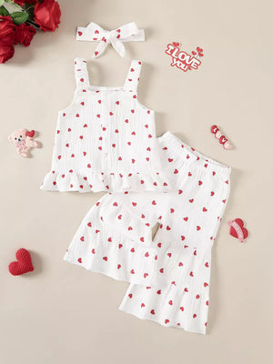 White baby set with red hearts, ruffled hem tank top, shorts, and headband.