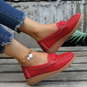 Deep Red leather loafers with braided detail and white stitching.