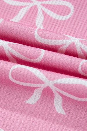 Pink ribbed loungewear set with white bow print detail