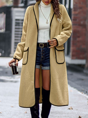 Camel teddy coat with contrast trim detailing, open front, long sleeves, and pockets.